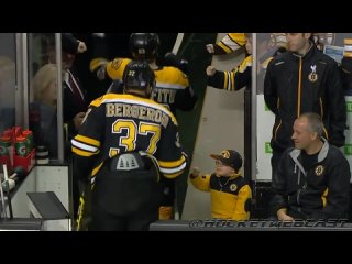 a young fan greets his team