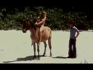 a naked lady her ass on a beach